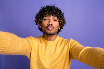 Photo of funny cheerful nice man wear yellow stylish clothes recording video isolated on violet color background