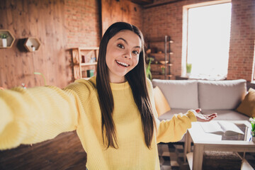 Canvas Print - Photo portrait of attractive teen woman take selfie photo hand point dressed yellow outfit cozy day light home interior living room