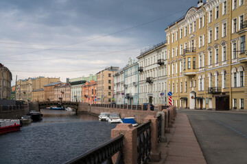 Moika River Embankment and Bolshoy Konyushenny Bridge on a cloudy spring morning, Saint Petersburg, Russia