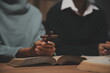 © Sirikarn Rinruesee - Christian group are praying to god with the bible and sharing the gospel. Concept of faith for god.