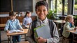 © nilawan - Happy African American School Boy Holding Books.