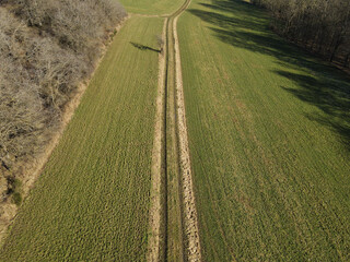 View from above of a dirt road in the countryside in spring 