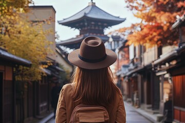 Sticker - a woman wearing a hat walking down a street