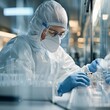 © Paniti - Lab technician in protective gear handling advanced gene-editing tools in a biotechnology lab