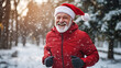 © Art.disini - A man in a Santa hat and red jacket is running in the snow.