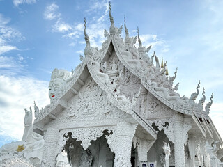 Wall Mural - Wat Huay Pla Kang, or Temple of Goddess of Mercy, at Chiang Rai, Thailand. Big Guan Yin Buddha statue with its holy white temple, sitting on the hill mountain top or summit.