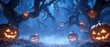 © raja - Glowing Jack-O'-Lanterns in a Foggy Halloween Forest
