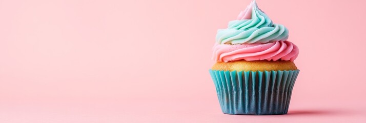 A single cupcake with swirls of pink and blue icing sits against a soft pastel background, highlighting its enticing design and colorful presentation