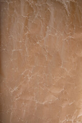 close up background of cracked brown wax paper