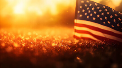 Canvas Print - A sunset backdrop featuring the American flag on grass.