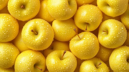 Wall Mural - Bright yellow apples glisten with water droplets, creating an inviting display. The arrangement highlights their freshness and appeal, perfect for creating an appetizing atmosphere