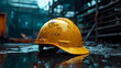 © Siasart Stock - A yellow hard hat resting on a wet surface in a rainy environment.