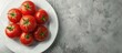 © Ilgun - Fresh tomatoes on a plate Top view with copyspace for text