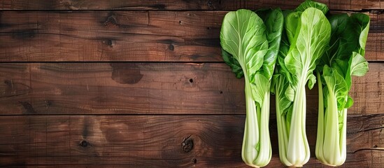 Fresh bok choy on a wooden surface. Copy space image. Place for adding text and design