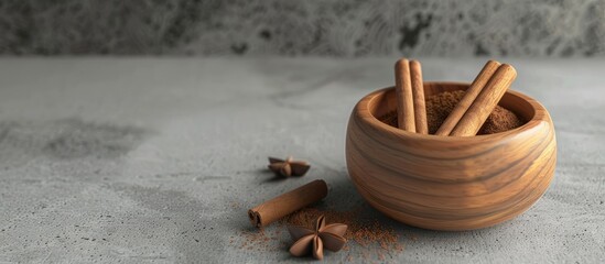 Sticker - Ceylon cinnamon sticks alongside cinnamon powder in a wooden bowl on a concrete surface Copy space