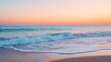 Wall Mural - Calm ocean wave crashing on sandy beach during a beautiful sunset.