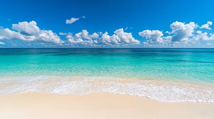 Wall Mural - a tranquil scene of a pristine sandy beach with crystal clear turquoise waters and a bright blue sky
