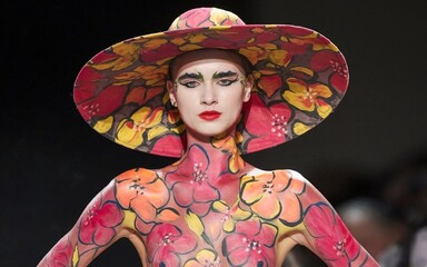 Model Showcasing Artistic Body Paint in Floral Designs