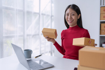 woman, online seller, using a tablet computer efficiently manages customer orders and delivery through the e-commerce platform