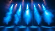 © Nattapong - Stage lights backdrop with vibrant blue beams casting a cool and immersive glow over the stage
