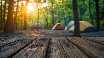 Wood table and Blurred camping and tents in forest. Good morning and fresh start of the day.