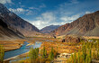 © Travel 'n' Lifestyle - View of beautiful Phander Valley with majestic mountains, serene river, and tranquil trees, Ghizer District, Pakistan.