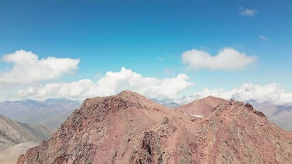 Wall Mural - Aerial view caucasus mountains range with colorful valleys on alpine zone. Kazbek mountain peak in background