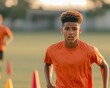 © Steveandfriend - A young athlete trains energetically on a sunny field, showcasing dedication and passion for soccer with agility and focus.