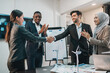 © chokniti - Successful Business Team in Office Cooperation, Professional Partnership Communication Highlighted as Colleagues Shake Hands and Collaborate, Teamwork Group Success in Corporate Setting
