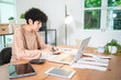 © chokniti - Modern Businesswoman Working from Home, Young Female Entrepreneur Using Laptop for Freelance Projects in Cyberspace, Embracing Technology Communication for a Flexible Lifestyle, Online Business