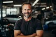 © NikoG - Portrait of a middle aged male car mechanic in workshop