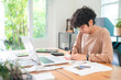 © chokniti - Modern Businesswoman Working from Home, Young Female Entrepreneur Using Laptop for Freelance Projects in Cyberspace, Embracing Technology Communication for a Flexible Lifestyle, Online Business