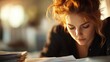 © familymedia - A focused woman reads papers intensely in a warmly lit room. The ambient lighting and her concentration create a scene of dedication and intellectual engagement.