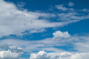 Clouds In Blue Sky. Clear blue skies with fluffy white clouds.