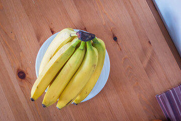 Fresh ripe banana fruit on living room table