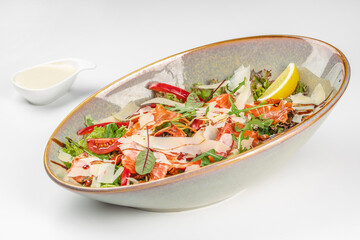 Fresh salmon and vegetable salad served in a bowl. Restaurant menu, dieting, cookbook recipe top view