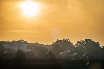 Sunset over new build house development estate in england uk