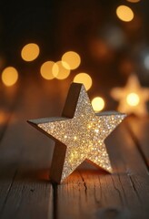 Poster - Close up photo of a glittering star on a rustic wooden table with bokeh light in the back