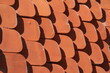 © Acento Creativo - Detail of an old roof made of red clay tiles. Pattern. Texture. Red tile gable roof. Background with copy space.