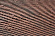 © Acento Creativo - Old roof made of red clay tiles. Pattern. Texture. Red tile gable roof. Background with copy space.