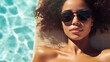 © Andrii  - Sun-Kissed Young Woman Enjoying Poolside Lounge