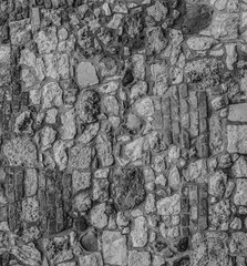 Poster - gray stone background of stacked cobblestones upright pattern closeup