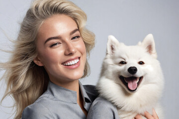 Caucasian white woman playing with a Spitz dog on a white background.