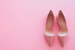 © dvoevnore - Pair of elegant women's high heel shoes on pink background