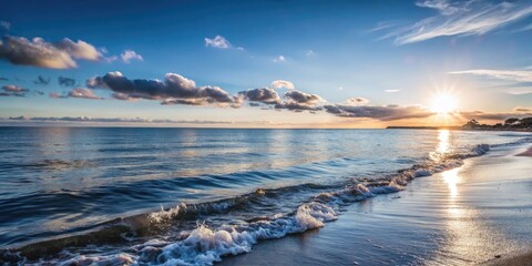 Wall Mural - Tranquil ocean waves under a clear sky.