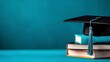 © nuengneng - A close-up of a graduation cap resting on a stack of books, symbolizing academic achievement and educational success.