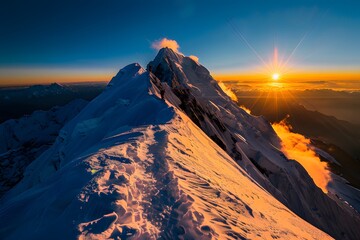 mountain peak standing alone in an expansive landscape.
stunning sunrise from the peak of a mountain, view and clear sky.