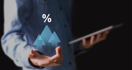 Interest rates and dividends, business development with percentage symbol and upward arrow for long-term retirement investing.	