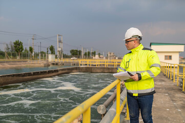 Wall Mural - Environmental engineers work at wastewater treatment plants,Water supply engineering working at Water recycling plant for reuse