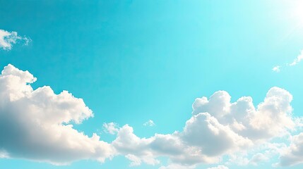 bright blue sky with fluffy white clouds creating a serene and tranquil atmosphere, perfect for back